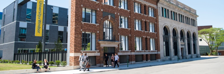 school of social work at university of windsor. photo is of 3-story brick building on a sunny day.