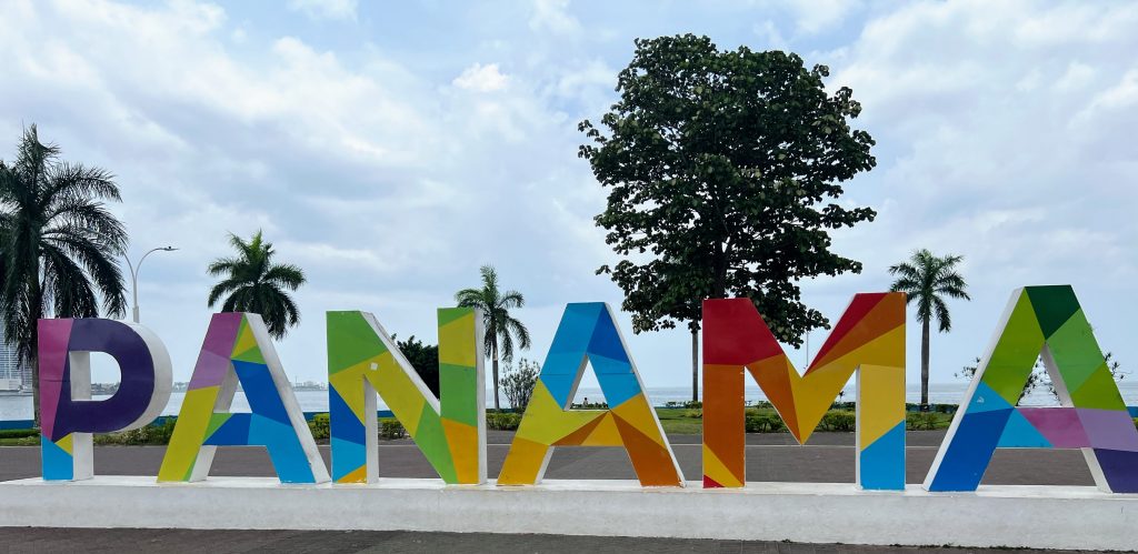 Panama sign. Letters are approximately 4 feet high and are painted in various bright colours, such as purple, blue, red, and yellow.