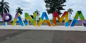 Panama sign on the waterfront. Panama is painted in a variety of colours.