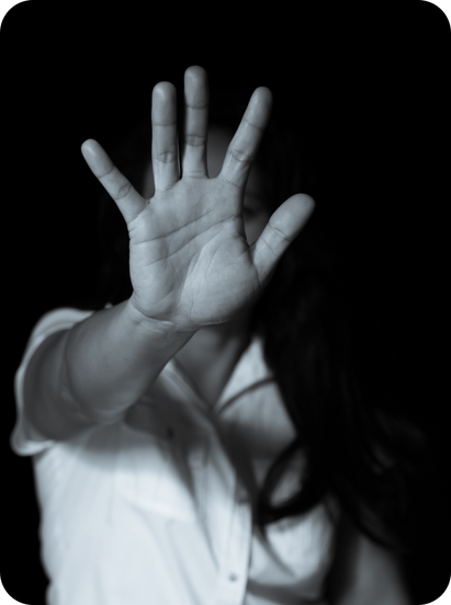 a black and white photo of a person with their hands up